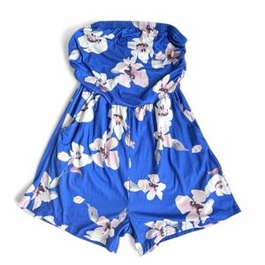 Blue print strapless romper with pockets. Size medium